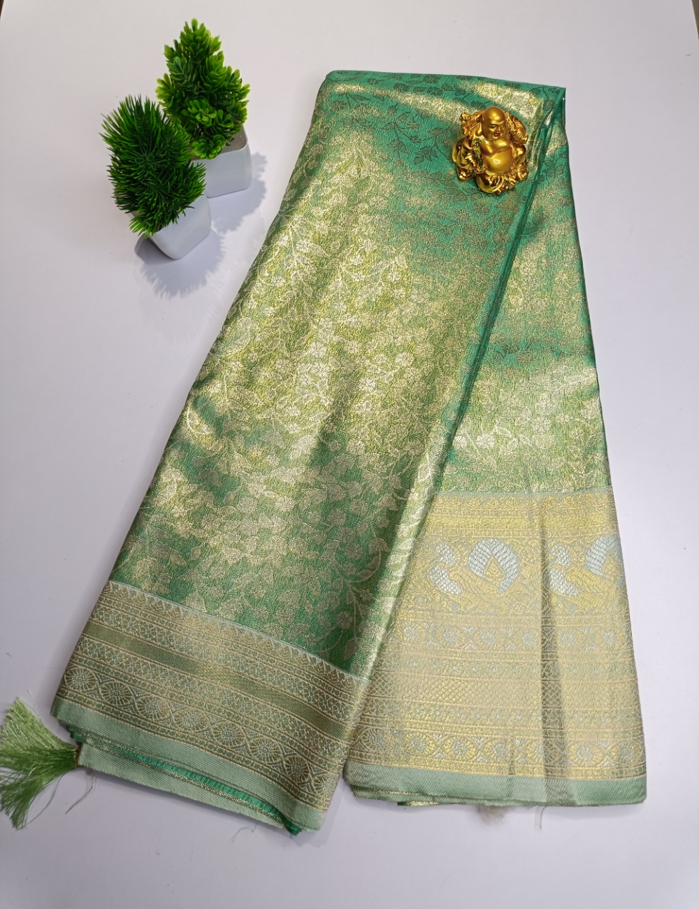 Pastel Green Floral Silk Saree with Silver Zari Border and blouse piece