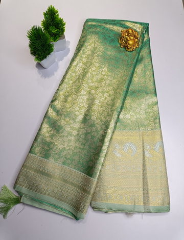 Pastel Green Floral Silk Saree with Silver Zari Border and blouse piece