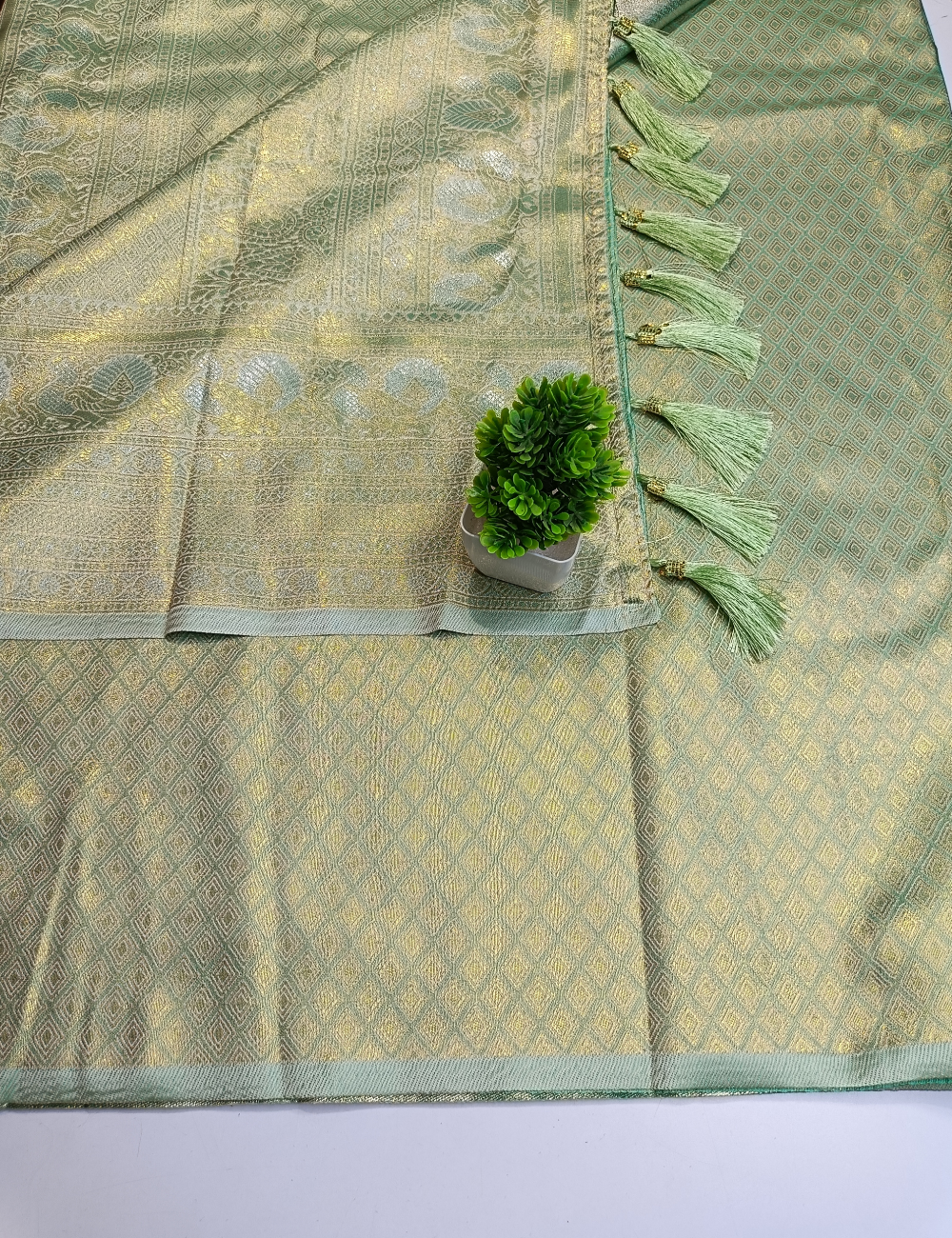 Pastel Green Floral Silk Saree with Silver Zari Border and blouse piece